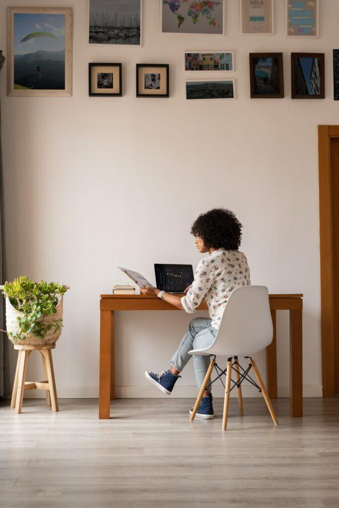 Woman sitting at desk working on laptop
